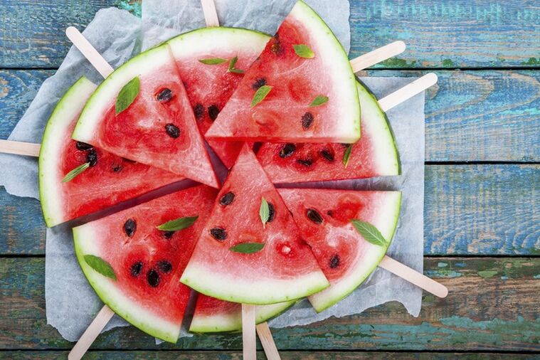 Slices of watermelon on a stick for a watermelon diet snack